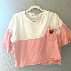 Cropped white and pink tee.